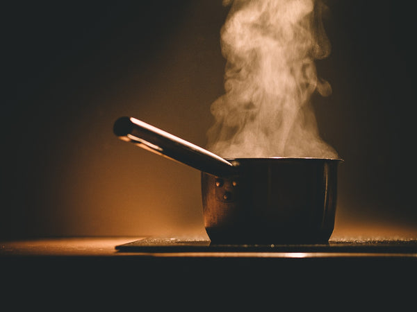 steaming pot on stove with rangehood