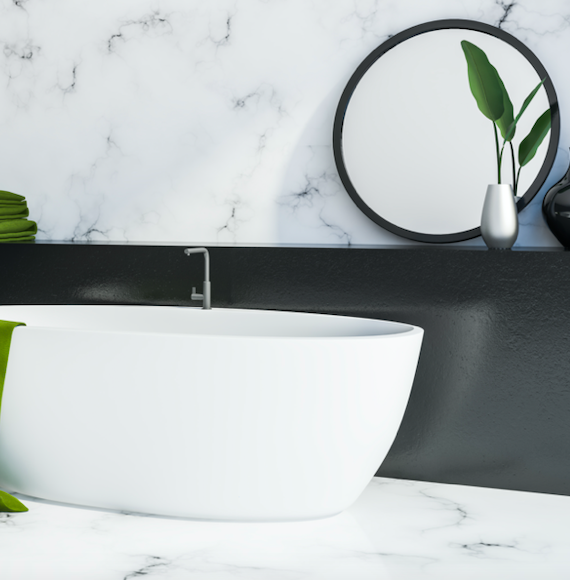 minimal bath tub in a marble inspired bathroom with bath plugs